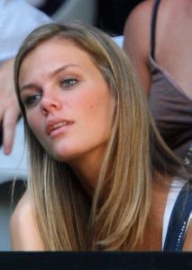 Brooklyn Decker watching a tennis game of her fiance