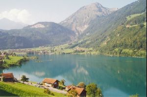 Cities Europe Switzerland : The Swiss town of Lungern on the Lungernsee, with Mount Giswil above