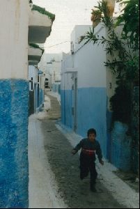 Cities Africa Morocco : A Moroccan kid running through the Kasbah in Rabat.