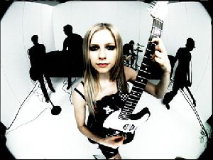 Avril Lavigne playing an electric guitar