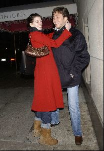 Anne Hathaway wearing a red double-chest coat