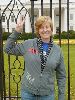 Cindy Sheehan gives the peace sign in front of the White House in 2006