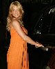 Pictures of Jessica Simpson wearing an orange dress