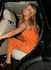 Pictures of Jessica Simpson wearing an orange dress