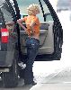 Pictures of Jessica Simpson checking her belly button