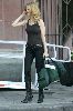 Actress Heather Graham pictures wearing a black tight tank top, tight jeans and pair of sexy leather