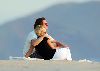 Model Jenny McCarthy pic with Jim Carrey watching the sun set in a romantic atmosphere