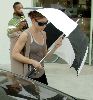 Jessica Biel pics fighting off the paparazzi with her umbrella