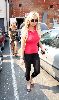 Sexy Lindsay Lohan pictures wearing a Tight pink t-shirt and a sexy black Tight