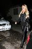 Sexy Lindsay Lohan wearing a black Leggings with black boots pictures