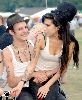 Amy Winehouse sitting on Blake Fielder-Civils lap