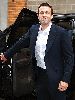 Ben Affleck  arrives for daily show wearing a navy suit over a white shirt