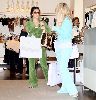 Anna Paquin and Kim Kardishian wearing a green jumpsuit shopping in August 2007