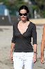 Courteney Cox naked chest under an open v-neck black shirt