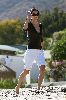 Courteney Cox white denim three-quarters shorts