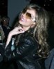 Thalia wearing brown shaded sunglasses