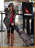 Tila Tequila spotted at the airport wearing a gray jacket over black leggings and tall sugar brown boots