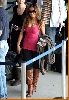 Tila Tequila picture at the airport wearing a pink sleevless top and dark shaded sunglasses