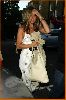 Jennifer Aniston in cleavagey dress arriving at La Famiglia restaurant