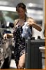 Tia Carrere : Tia Carrere shows some skin as she loads her shopping bags4 484fe73949c60