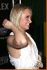 Hayden Panettiere on the red carpet wearing a simple elegant white dress