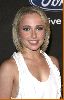 Hayden Panettiere on the red carpet wearing a simple elegant white dress