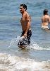 Jesse Metcalfe : Jesse Metcalfe swimming suit - showing his arm Tattoo