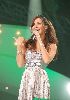 nancy ajram : in a concert wearing a silver dress