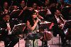 Diana Karazon : diana singing on stage with an orchestra