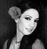 Diana Haddad : black and white poster with a rose in her hair - old hair style