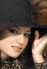 Diana Haddad : wearing a large black hat