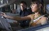 Olga Kurylenko : pictures from the movie Quantum of Solace with her co-star Daniel Craig while she is driving their car