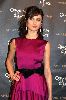 Olga Kurylenko : Olga wearing a dark pink dress with a black waist ribbon at the Quantum of Solace in Amsterdam movie Premiere