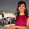 Olga Kurylenko : Olga with a boquet of flowers on the stage of the Quantum of Solace movie Premiere in Amsterdam