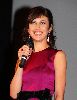 Olga Kurylenko : Olga picture wearing a dark pink dress with a black waist ribbon on stage of the Quantum of Solace in Amsterdam movie Premiere