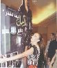 Amal Hijazi : amal hijazi carrying her poster cartoon model back home with her