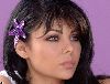 Haifa Wehbe : haifa looks innocent with this purple star fish hair clip, this is from the famous video clip that was released in 2006 boos el wawa