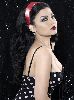 Haifa Wehbe : black and white dress with a full red lipstick just like the 70 s fashion trend