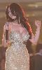 Haifa Wehbe : haifa on stage signing to her audience wearing a golden dress