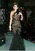 Haifa Wehbe : haifa wehbe on stage wearing a black dress designed in a multi-colored-jewelery fashion style