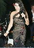 Haifa Wehbe : haifa on stage wearing a black dress designed in a multi-colored-jewelery fashion style