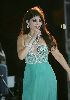 Haifa Wehbe : on stage signing to her audience wearing a green dress