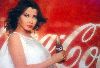 Nancy Ajram : the coca cola ad poster of nancy with the drink bottel in hand