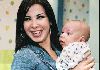 Nancy Ajram : nancy ajram holding a baby