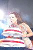 Nancy Ajram : nancy on stage blowing off the candels of her huge birthday cake