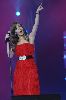 Nancy Ajram : nancy wearing a stunning red dress singing on stage in kuwait