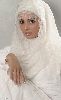 Hanan Turk : in a white outfit with hijab