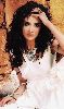 Hanan Turk : white dress and curly hair