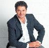 Ragheb Alama : wearing a dark gray suit