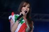 Nancy Ajram : concert in Beirut wearing the lebanese flag on her shoulder